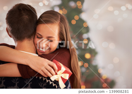 Home, hug and couple with love, Christmas and festive season with marriage and holiday. Apartment, embrace or man with woman or vacation with Xmas or celebration with relationship or bonding together Home, hug and couple with love, Christmas and festive season with marriage and holiday. Apartment, embrace or man with woman or vacation with Xmas or celebration with relationship or bonding together 139908281