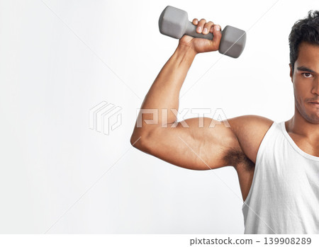 Gym, mockup and portrait of man with dumbbell in studio for weightlifting, sports or resilience on white background. Half, face or guy bodybuilder with space for power, performance or bicep challenge 139908289