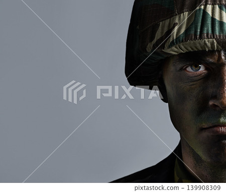 Man, portrait and soldier with camouflage for army, military war or battle on a gray studio background. Closeup of male person or commander with face paint or helmet in undercover disguise on mockup Man, portrait and soldier with camouflage for army, military war or battle on a gray studio background. Closeup of male person or commander with face paint or helmet in undercover disguise on mockup 139908309