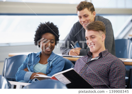 Student, studying and friends in a classroom with learning, education and university with smile. Book, college and test with notebook, lecture and group with diversity and young people at school Student, studying and friends in a classroom with learning, education and university with smile. Book, college and test with notebook, lecture and group with diversity and young people at school 139908345