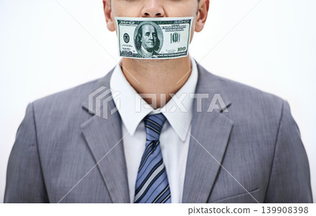 Business man, money and mouth for silence, bribe or corruption with suit in studio by white background. Person, cash and quiet for corporate crime with fraud, finance or illegal payment at job in USA Business man, money and mouth for silence, bribe or corruption with suit in studio by white background. Person, cash and quiet for corporate crime with fraud, finance or illegal payment at job in USA 139908398