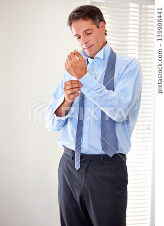 Mature, businessman and dressing for his job as corporate salesman in his home bedroom. Sleeves, cufflink and professional male person with fashion, style and shirt clothing getting ready in routine 139908441