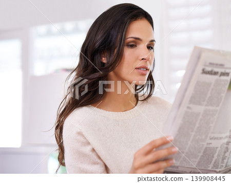 Woman, reading and newspaper in home, morning and thinking with information, update or global headlines. Person, girl and newsletter for media, finance and sports with international story in house Woman, reading and newspaper in home, morning and thinking with information, update or global headlines. Person, girl and newsletter for media, finance and sports with international story in house 139908445
