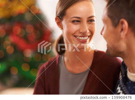 Smile, conversation and couple on a date on Christmas for romantic, holidays and love bonding. Happy, care and young man and woman talking in living room with xmas festive decoration at home. Smile, conversation and couple on a date on Christmas for romantic, holidays and love bonding. Happy, care and young man and woman talking in living room with xmas festive decoration at home. 139908476