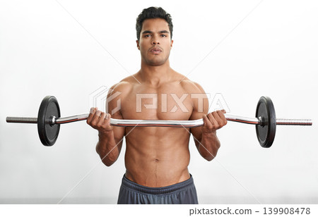 Man, portrait and barbell for arm workout fitness or curl training for muscle strength, performance or exercise. Bodybuilder, equipment and white background in studio for health, biceps or mockup Man, portrait and barbell for arm workout fitness or curl training for muscle strength, performance or exercise. Bodybuilder, equipment and white background in studio for health, biceps or mockup 139908478