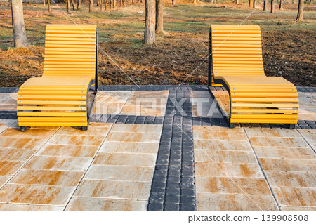wooden reclining benches in the park wooden reclining benches in the park 139908508
