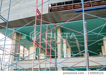 scaffolding on a multi-storey building under construction 139908520