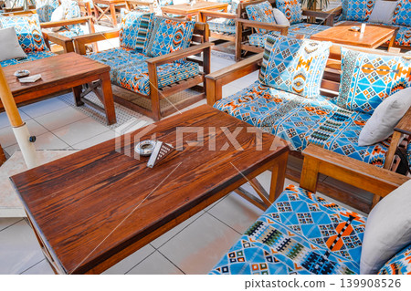 tables and sofas in an outdoor cafe tables and sofas in an outdoor cafe 139908526