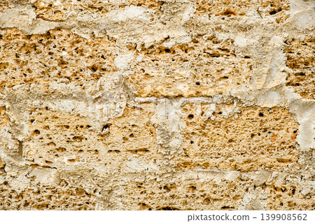 background of porous stone masonry close-up background of porous stone masonry close-up 139908562