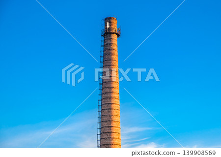 brick industrial chimney on background of sky brick industrial chimney on background of sky 139908569