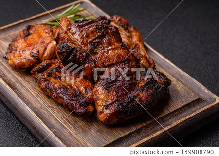 Chicken or turkey, poultry breast baked on the grill or barbecue. Grilled chicken Chicken or turkey, poultry breast baked on the grill or barbecue. Grilled chicken 139908790
