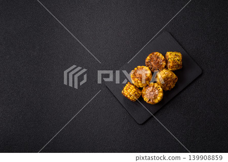 Corn chunks grilled or barbecued with salt and spices. Grilled corn Corn chunks grilled or barbecued with salt and spices. Grilled corn 139908859