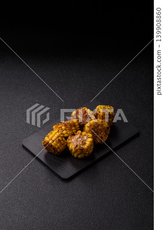 Corn chunks grilled or barbecued with salt and spices. Grilled corn Corn chunks grilled or barbecued with salt and spices. Grilled corn 139908860