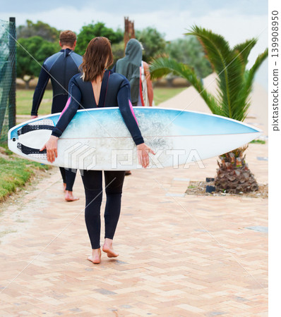 Surfer, rear view and friends or walking outdoor with surfboard for adventure, vacation and holiday. Surfing, group and people with travel in nature for exercise, water sports and swimming in summer Surfer, rear view and friends or walking outdoor with surfboard for adventure, vacation and holiday. Surfing, group and people with travel in nature for exercise, water sports and swimming in summer 139908950