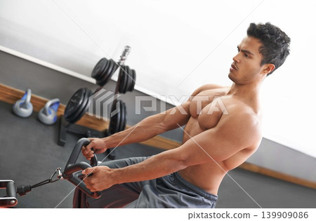Man, workout and cable exercise for arms in gym or muscle performance or bodybuilder training, fitness or strong. Male person, shirtless and equipment in Miami for chest routine, health or wellbeing Man, workout and cable exercise for arms in gym or muscle performance or bodybuilder training, fitness or strong. Male person, shirtless and equipment in Miami for chest routine, health or wellbeing 139909086