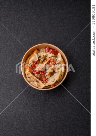 Gyoza, Chinese or Japanese meat dumplings, is an Asian food with hot peppers. Gyoza with meat 139909181