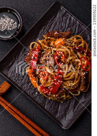 Food, Chinese or Japanese noodles with meat, vegetables, and spices. Noodles with beef Food, Chinese or Japanese noodles with meat, vegetables, and spices. Noodles with beef 139909222