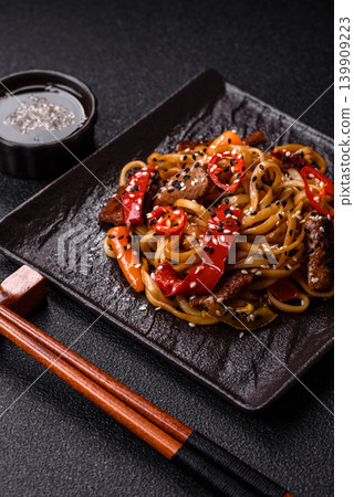 Food, Chinese or Japanese noodles with meat, vegetables, and spices. Noodles with beef Food, Chinese or Japanese noodles with meat, vegetables, and spices. Noodles with beef 139909223