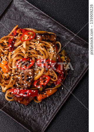 Food, Chinese or Japanese noodles with meat, vegetables, and spices. Noodles with beef Food, Chinese or Japanese noodles with meat, vegetables, and spices. Noodles with beef 139909226