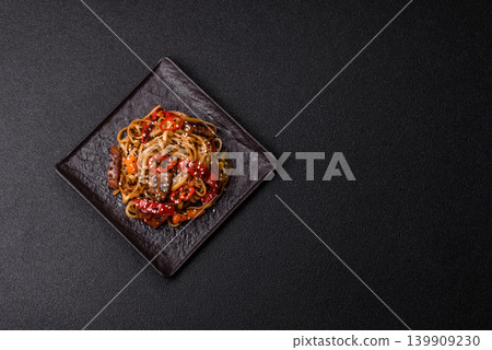 Food, Chinese or Japanese noodles with meat, vegetables, and spices. Noodles with beef Food, Chinese or Japanese noodles with meat, vegetables, and spices. Noodles with beef 139909230