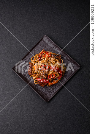 Food, Chinese or Japanese noodles with meat, vegetables, and spices. Noodles with beef Food, Chinese or Japanese noodles with meat, vegetables, and spices. Noodles with beef 139909231
