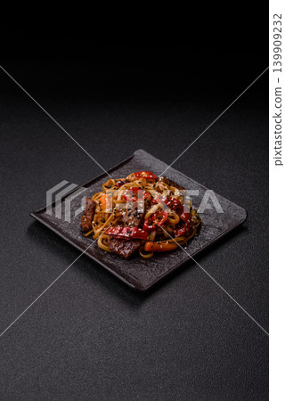 Food, Chinese or Japanese noodles with meat, vegetables, and spices. Noodles with beef Food, Chinese or Japanese noodles with meat, vegetables, and spices. Noodles with beef 139909232