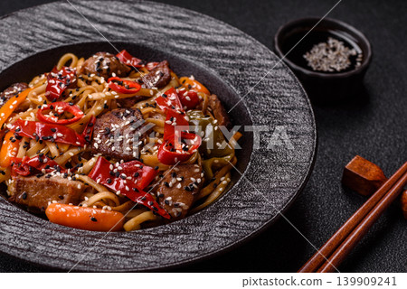 Food, Chinese or Japanese noodles with meat, vegetables, and spices. Noodles with beef Food, Chinese or Japanese noodles with meat, vegetables, and spices. Noodles with beef 139909241