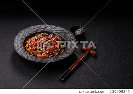 Food, Chinese or Japanese noodles with meat, vegetables, and spices. Noodles with beef Food, Chinese or Japanese noodles with meat, vegetables, and spices. Noodles with beef 139909245