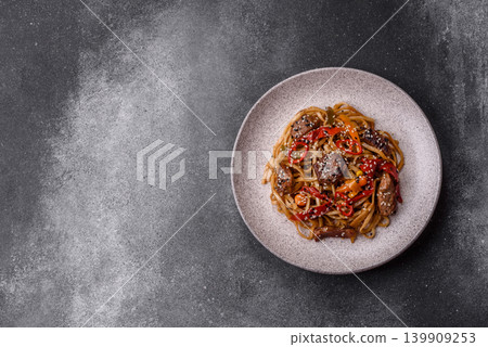Food, Chinese or Japanese noodles with meat, vegetables, and spices. Noodles with beef Food, Chinese or Japanese noodles with meat, vegetables, and spices. Noodles with beef 139909253