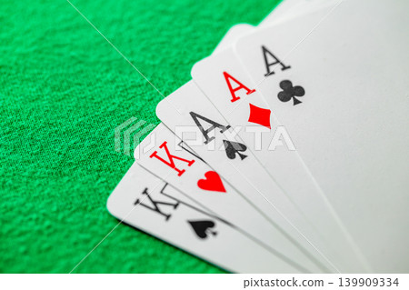 three of a kind aces and kings, set playing cards in poker on green cloth three of a kind aces and kings, set playing cards in poker on green cloth 139909334