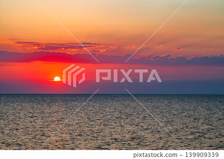 sunset red sun over the sea sunset red sun over the sea 139909339