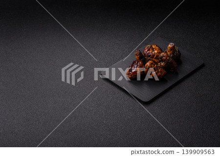 Grilled or barbecued mushroom halves with salt and spices. Grilled mushrooms Grilled or barbecued mushroom halves with salt and spices. Grilled mushrooms 139909563