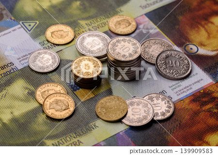 Switzerland, Swiss franc paper money and coins, financing and commodity exchange. Swiss currency Switzerland, Swiss franc paper money and coins, financing and commodity exchange. Swiss currency 139909583