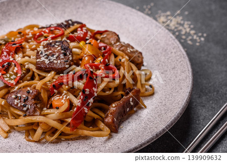 Food, Chinese or Japanese noodles with meat, vegetables, and spices. Noodles with beef Food, Chinese or Japanese noodles with meat, vegetables, and spices. Noodles with beef 139909632
