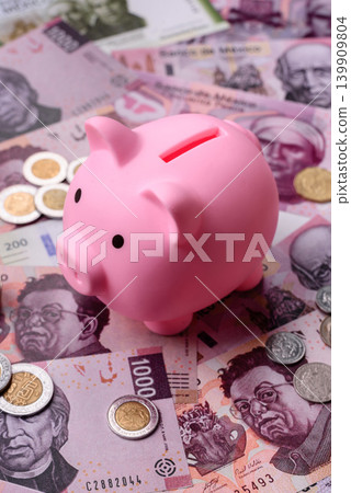 A piggy bank as a concept for storing, accumulating, and saving financial resources. A piggy bank A piggy bank as a concept for storing, accumulating, and saving financial resources. A piggy bank 139909804