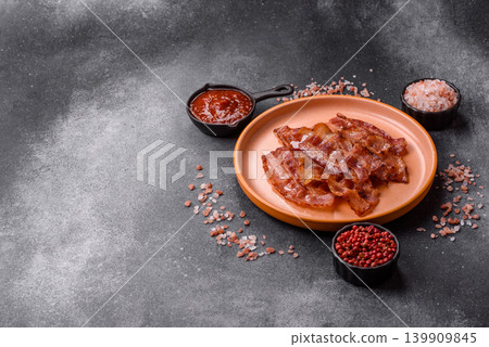 Fried fresh bacon slices with layers of meat or prosciutto with salt and spices. Fried bacon Fried fresh bacon slices with layers of meat or prosciutto with salt and spices. Fried bacon 139909845