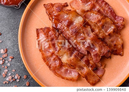 Fried fresh bacon slices with layers of meat or prosciutto with salt and spices. Fried bacon 139909848
