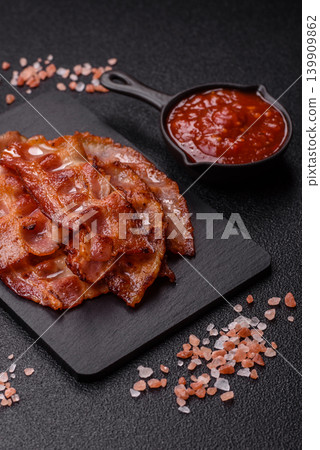 Fried fresh bacon slices with layers of meat or prosciutto with salt and spices. Fried bacon 139909862