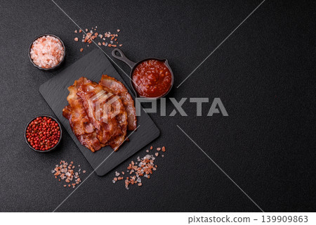 Fried fresh bacon slices with layers of meat or prosciutto with salt and spices. Fried bacon Fried fresh bacon slices with layers of meat or prosciutto with salt and spices. Fried bacon 139909863