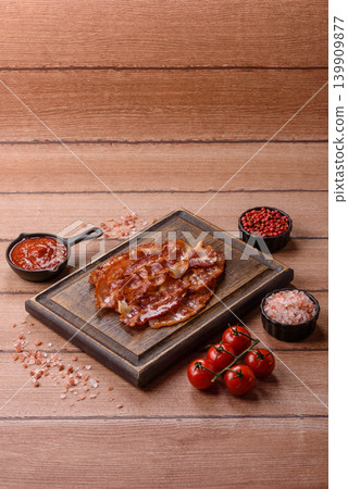 Fried fresh bacon slices with layers of meat or prosciutto with salt and spices. Fried bacon 139909877