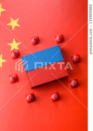 The cargo container ban on the China flag as a conceptual backdrop. The cargo container embargo The cargo container ban on the China flag as a conceptual backdrop. The cargo container embargo 139909960