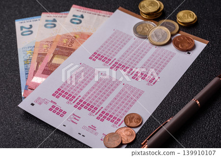 Lottery ticket, banknotes, and a pen, a chance to win big, gambling. Lottery ticket 139910107