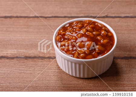 Beans in tomato sauce, a canned stew for the dinner table. Beans in tomato sauce 139910158
