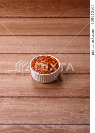 Beans in tomato sauce, a canned stew for the dinner table. Beans in tomato sauce Beans in tomato sauce, a canned stew for the dinner table. Beans in tomato sauce 139910162