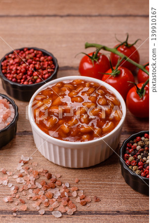 Beans in tomato sauce, a canned stew for the dinner table. Beans in tomato sauce Beans in tomato sauce, a canned stew for the dinner table. Beans in tomato sauce 139910167