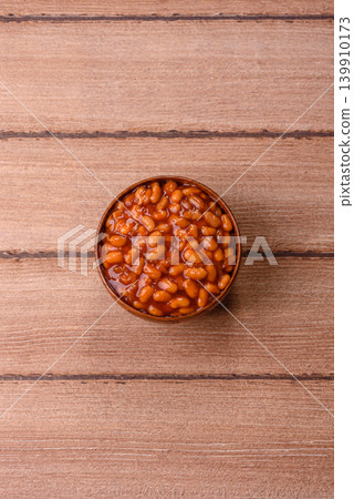 Beans in tomato sauce, a canned stew for the dinner table. Beans in tomato sauce Beans in tomato sauce, a canned stew for the dinner table. Beans in tomato sauce 139910173