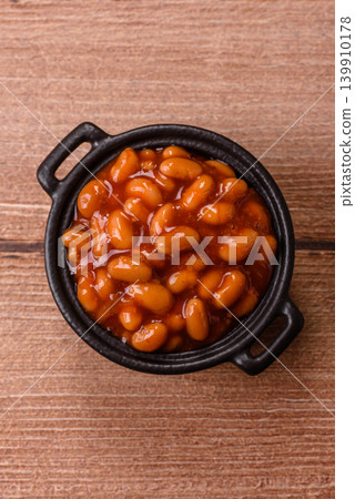 Beans in tomato sauce, a canned stew for the dinner table. Beans in tomato sauce Beans in tomato sauce, a canned stew for the dinner table. Beans in tomato sauce 139910178