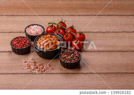 Beans in tomato sauce, a canned stew for the dinner table. Beans in tomato sauce Beans in tomato sauce, a canned stew for the dinner table. Beans in tomato sauce 139910182