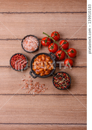 Beans in tomato sauce, a canned stew for the dinner table. Beans in tomato sauce 139910183