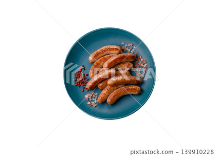 Grilled or barbecued chicken sausages for the dinner table. Grilled sausages 139910228